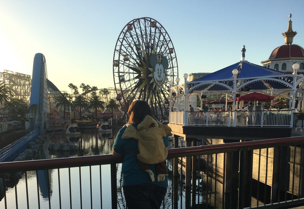 Standing on Pixar Pier with my Yoda backpack